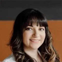 A headshot photo of Dr. Jacquelin Escoto, an optometrist at Focus Optical