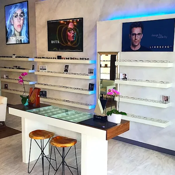 A table with stools for eyeglasses fittings