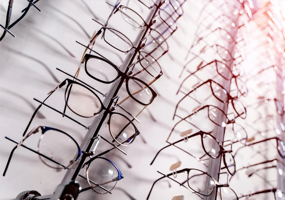 A wall rack of eyeglasses